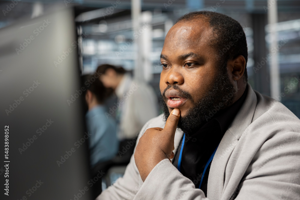 Poster man working in data center analyzing software logs metrics on pc, optimizing storage systems. africa