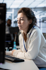 System administrator in server hub implementing power management solutions to reduce energy...