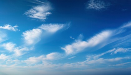 Obraz premium nice small clouds cute fluffy cirrus clouds on a blue sky background with a gradient effect postcard cloudscape