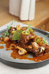 Plated Meat Dish with Sauce and Modern Styling