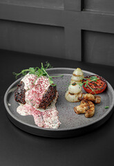 Fine Dining Plate with Grilled Meat and Potatoes