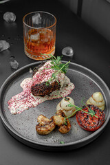 Elegant Plating of Medium Rare Steak and Sauce