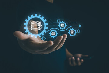 Businessman holding a digital gear icon symbolizing the ETL process in cloud data management,...