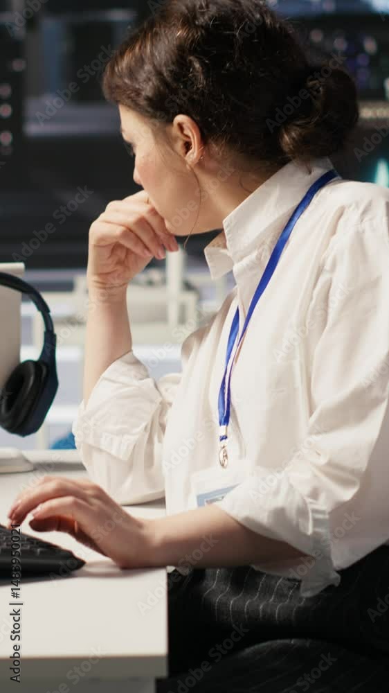 Poster vertical video data center technician monitors server rigs performing ai training and inference task