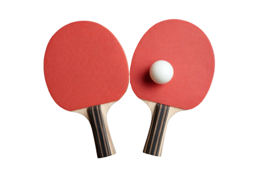 Two ping pong paddles and a ball on a black background close up shot