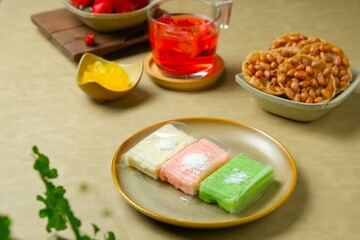 Getuk or gethuk on rustic plate. Traditional snack from Indonesia. Mashed cassava served with...