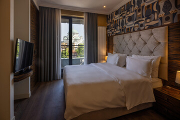 Contemporary double bed hotel room featuring stylish furnishings and clean design