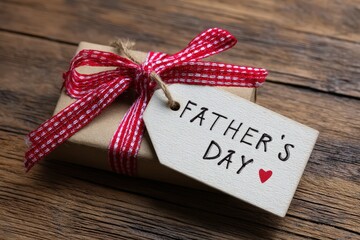 Gift with checkered ribbon and Father's Day tag.