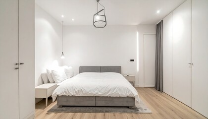 Modern bedroom interior with white walls.