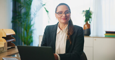 Business, woman or laptop with portrait in office for legal research, case preparation or drafting...
