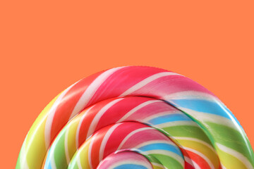 Swimming mattress in shape of candy on orange background