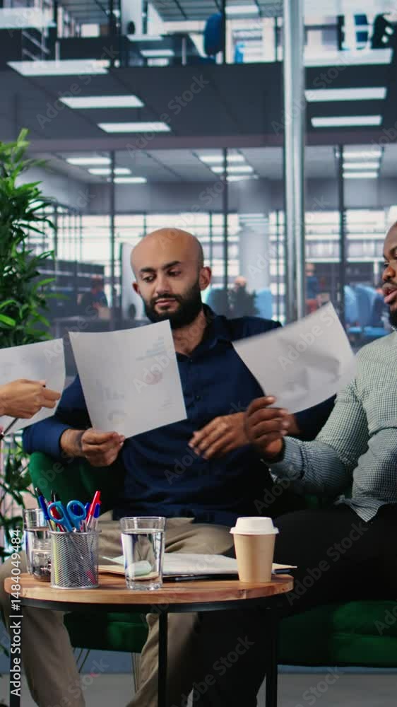 Poster vertical video diverse business professionals using analysis tools to extract details and insights f