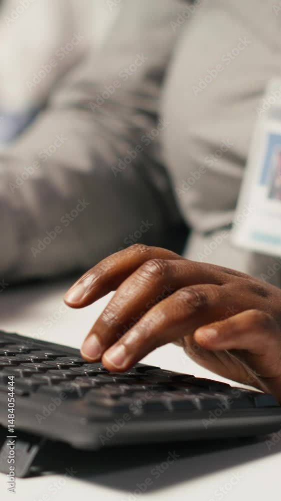Poster vertical video close up of data center admin coding, writing script on pc identifying bottlenecks. s