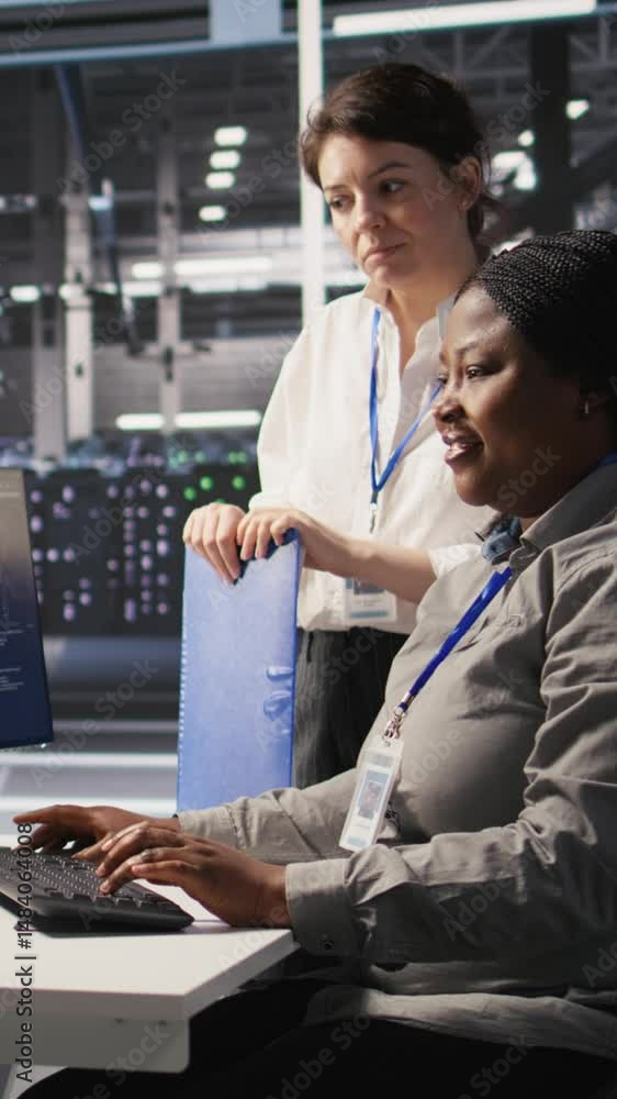 Poster vertical video happy data center manager pleased by work done by team integrating ai automation tool