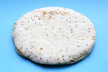 Quinoa tortilla wraps on blue background