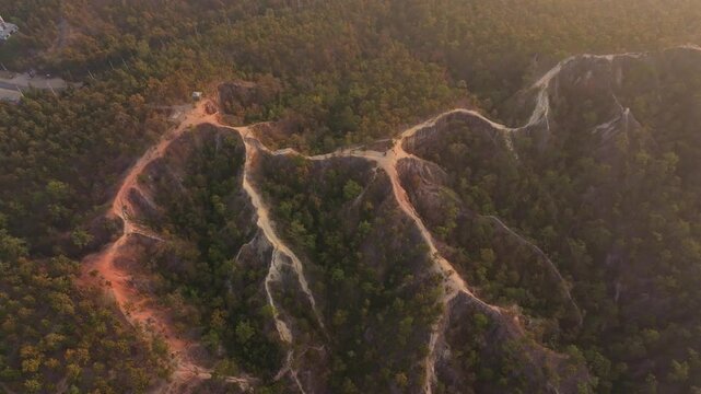 Highland canyon landscape glows in early morning light, Thailand Aerial drone video