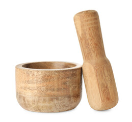 Wooden mortar with pestle isolated on white