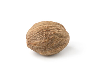 One whole fresh nutmeg isolated on white