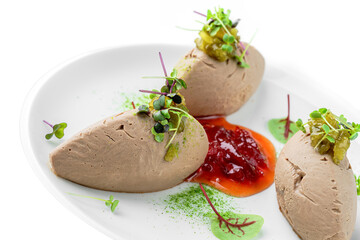 Meat pate foie gras with fresh microgreens on a plate isolated on white background. Healthy food,...