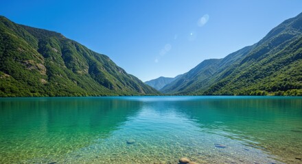 Mountain lake reflecting serenity and natural beauty with turquoise water and lush greenery