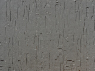 Textured Gray Wall Surface with Vertical Patterns