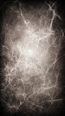 A grunge texture creating a dark, distressed background, enhanced by light lines and scratches. The rough, worn appearance evokes a sense of vintage or urban decay, adding a raw and edgy atmosphere to