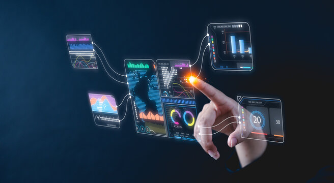 A hand interacts with futuristic virtual data screens displaying analytics and charts on a dark background.