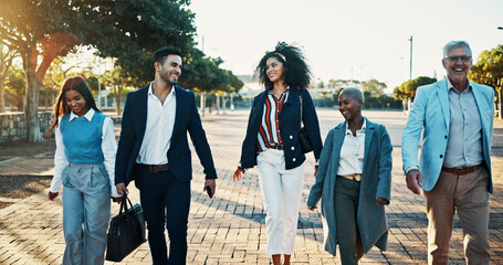 Morning, commute and business people in park for travel to work with discussion and teamwork. Happy, laugh and bonding with coworkers walking in nature together for collaboration or project review