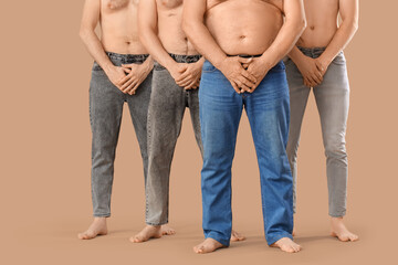 Group of men on beige background. Body positive concept