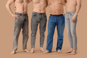Group of men on beige background. Body positive concept