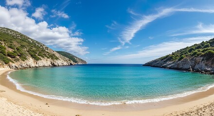 Secluded sandy beach cove nestled between cliffs and turquoise waters under a sunny sky