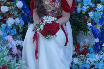 Beautiful stylish trendy Women's hands with cozy manicure multicolored flower. Concept beauty care salon spa. Nail Art featuring floral designs.