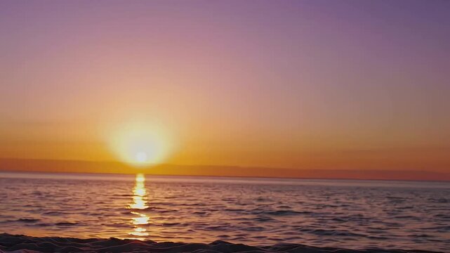 Tranquil sunset meditation scene with a woman facing the sea. Great for wellness, balance, and personal growth visuals.