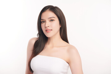 A beautiful young Asian woman with clean, fresh skin against a white background. Skincare, facial treatment, cosmetology, beauty, and spa. An elegant portrait of an Asian woman.