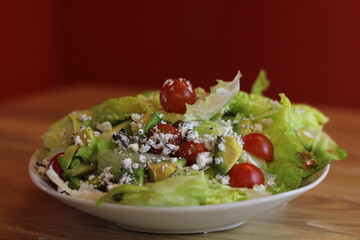A vibrant garden salad featuring fresh greens, cherry tomatoes, and rich toppings that reflect health, freshness, and delightful culinary combinations.