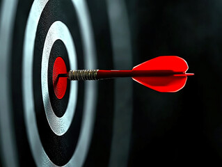 Business marketing success concept. The red dart arrow bullseye in the middle of the dart paper is the goal of the business.