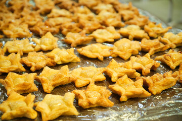 Pastelitos, traditional Argentine flaky snack, especially consumed on national holidays, freshly fried and ready to eat.
