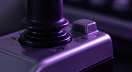 Close up view of a gaming joystick illuminated in soft purple light ambiance