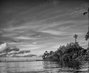 Clouds Above the Harbor Canal to the Sea in Black and White.