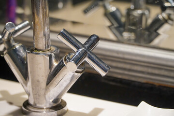 Fototapeta premium Faucet in a modern bathroom, close-up. Selective focus.