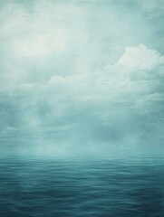 Fototapeta premium Calm Ocean Under a Cloudy Sky A Muted Teal and Gray Seascape