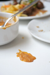 Sauce spilled on table after a meal conclusion