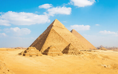 Majestic Giza Pyramids in Desert Under Clear Blue Sky 