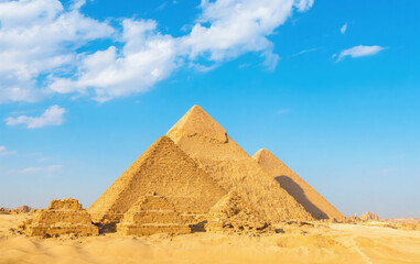 Majestic Giza Pyramids in Desert Under Clear Blue Sky 