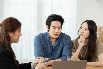 Therapist offering support to couple facing infertility, woman holding partner&rsquo;s hand for comfort, session reflecting emotional strength, shared struggle, and desire for healing through counseling