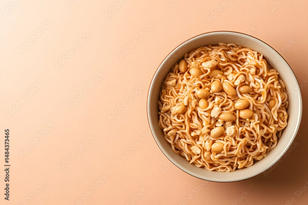 Poster overhead view of a bowl of instant noodles with nuts.