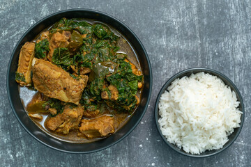 Spicy pork bone curry with betel leaves and rice, a local dish from southern Thailand.