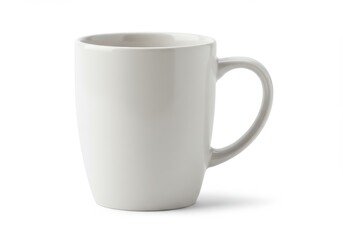 Fototapeta premium A simple white ceramic mug with a handle sits isolated on a white background