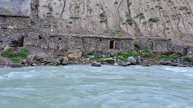 Old villages in Tajikistan. Tajikistan's road along the Zeravshan River near the Pamir highway. Old stone villages in the mountains of the Silk Road. 4К