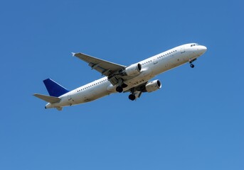 Obraz premium Passenger airplane ascends into the clear blue sky during the daytime for travel